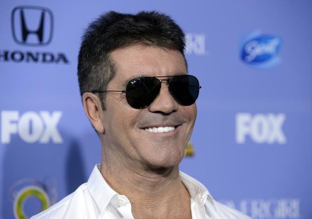 Judge Simon Cowell attends "The X Factor" season three premiere event in West Hollywood, California September 5, 2013. REUTERS/Phil McCarten Judge Simon Cowell attends "The X Factor" season three premiere event in West Hollywood, California September 5, 2013. REUTERS/Phil McCarten