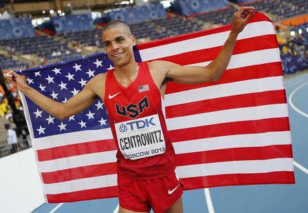 Matthew Centrowitz of the U.S holds up his national flag as he celebrates winning second place in the men's 1500 metres final during the IAA Matthew Centrowitz of the U.S holds up his national flag as he celebrates winning second place in the men's 1500 metres final during the IAA