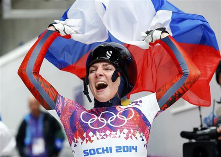 Russia's Elena Nikitina celebrates after competing in the women's skeleton event at the 2014 Sochi Winter Olympics February 14, 2014. REUTER Russia's Elena Nikitina celebrates after competing in the women's skeleton event at the 2014 Sochi Winter Olympics February 14, 2014. REUTER