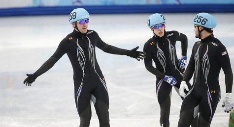 Skaters of the U.S. react after crashing during the men's 5,000 metres short track speed skating relay semi-final event at the Iceberg Skati Skaters of the U.S. react after crashing during the men's 5,000 metres short track speed skating relay semi-final event at the Iceberg Skati
