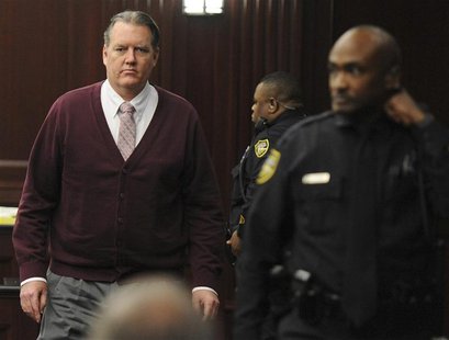 Michael Dunn returns to the courtroom during jury deliberations in his murder trial over the killing of Jordan Davis, in Jacksonville, Flori Michael Dunn returns to the courtroom during jury deliberations in his murder trial over the killing of Jordan Davis, in Jacksonville, Flori