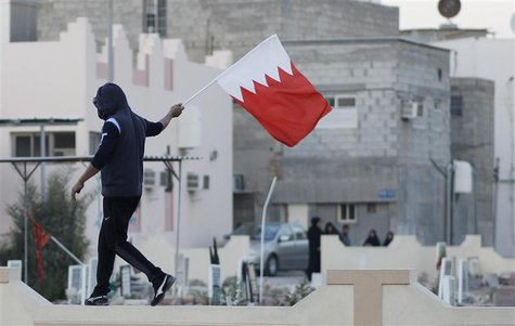 An anti-government protester waves a Bahraini flag in the village of Jidhafs, west of Manama, February 14, 2014. REUTERS/Hamad I Mohammed An anti-government protester waves a Bahraini flag in the village of Jidhafs, west of Manama, February 14, 2014. REUTERS/Hamad I Mohammed