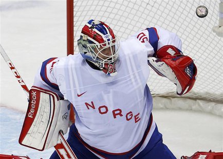 Norway's goalie Lars Haugen makes a save on Austria during the first period of their men's preliminary round ice hockey game at the Sochi 20 Norway's goalie Lars Haugen makes a save on Austria during the first period of their men's preliminary round ice hockey game at the Sochi 20