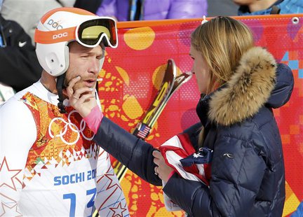 Bode Miller (L) of the U.S. cries next to his wife Morgan Beck in the mixed zone after finishing in the men's alpine skiing Super-G competit Bode Miller (L) of the U.S. cries next to his wife Morgan Beck in the mixed zone after finishing in the men's alpine skiing Super-G competit