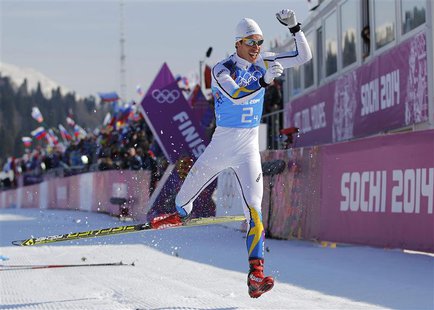 Sweden's Marcus Hellner celebrates after crossing the finish line during the men's cross-country 4 x 10km relay event at the 2014 Sochi Wint Sweden's Marcus Hellner celebrates after crossing the finish line during the men's cross-country 4 x 10km relay event at the 2014 Sochi Wint