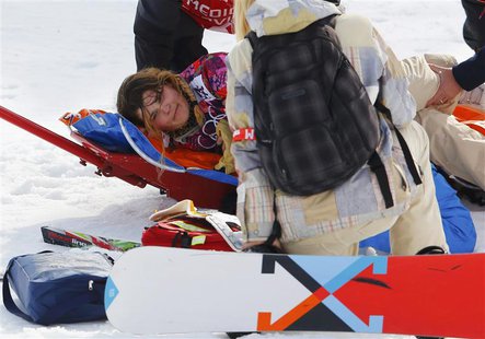 Jacqueline Hernandez of the U.S. reacts on a stretcher after crashing during the women's snowboard cross qualification round at the 2014 Soc Jacqueline Hernandez of the U.S. reacts on a stretcher after crashing during the women's snowboard cross qualification round at the 2014 Soc