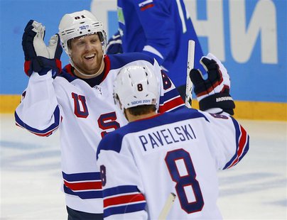 Team USA's Phil Kessel is congratulated by teammate Joe Pavelski after scoring on Slovenia during the first period of their men's preliminar Team USA's Phil Kessel is congratulated by teammate Joe Pavelski after scoring on Slovenia during the first period of their men's preliminar