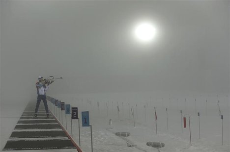 An athlete practices on the shooting range before the men's biathlon 15km mass start event at the 2014 Sochi Winter Olympics February 16, 20 An athlete practices on the shooting range before the men's biathlon 15km mass start event at the 2014 Sochi Winter Olympics February 16, 20