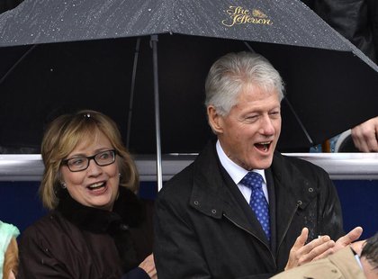 Former U.S. President Bill Clinton (R) and his wife Hillary attend the swearing-in ceremony of Terry McAuliffe as Virginia's governor in Ric Former U.S. President Bill Clinton (R) and his wife Hillary attend the swearing-in ceremony of Terry McAuliffe as Virginia's governor in Ric