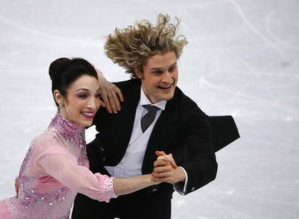 Meryl Davis (L) and Charlie White of the U.S. compete during the figure skating ice dance short dance program at the Sochi 2014 Winter Olymp Meryl Davis (L) and Charlie White of the U.S. compete during the figure skating ice dance short dance program at the Sochi 2014 Winter Olymp