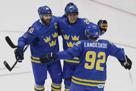 Sweden's Henrik Zetterberg (40) celebrates his goal with teammates Alexander Steen (20) and Gabriel Landeskog (92) during the second period of their men's preliminary round hockey game against the Czech Republic at the Sochi 2014 Winter Olympic Games, February 12, 2014.
Credit: Reuters/Grigory Dukor
Sweden's Henrik Zetterberg (40) celebrates his goal with teammates Alexander Steen (20) and Gabriel Landeskog (92) during the second period of their men's preliminary round hockey game against the Czech Republic at the Sochi 2014 Winter Olympic Games, February 12, 2014.
Credit: Reuters/Grigory Dukor