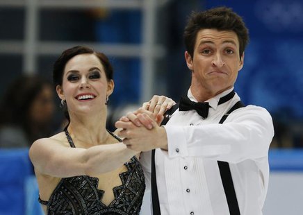Canada's Tessa Virtue and Scott Moir compete during the Figure Skating Ice Dance Short Dance Program at the Sochi 2014 Winter Olympics, Febr Canada's Tessa Virtue and Scott Moir compete during the Figure Skating Ice Dance Short Dance Program at the Sochi 2014 Winter Olympics, Febr