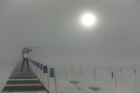 An athlete practices on the shooting range before the men's biathlon 15km mass start event at the Sochi 2014 Winter Olympics February 16, 20 An athlete practices on the shooting range before the men's biathlon 15km mass start event at the Sochi 2014 Winter Olympics February 16, 20