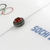 A stone is seen during a women's curling round robin game at the 2014 Sochi Winter Olympics at the Ice Cube Curling Center February 17, 2014 A stone is seen during a women's curling round robin game at the 2014 Sochi Winter Olympics at the Ice Cube Curling Center February 17, 2014