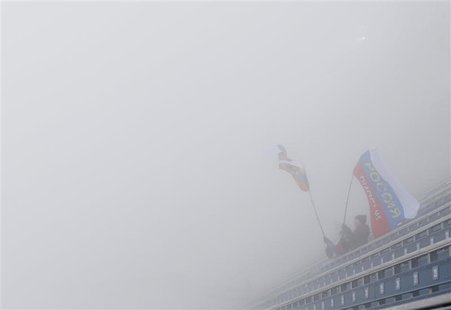 Fans of Russia are seen in the spectator stands amidst thick fog at the Laura Cross Country Ski and Biathlon Center during the 2014 Sochi Wi Fans of Russia are seen in the spectator stands amidst thick fog at the Laura Cross Country Ski and Biathlon Center during the 2014 Sochi Wi