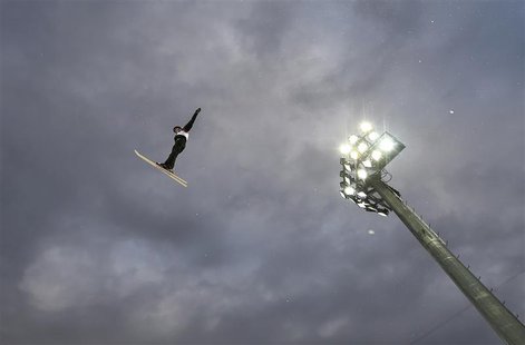 Belarus' Alexei Grishin performs a jump during the men's freestyle skiing aerials qualification round at the 2014 Sochi Winter Olympic Games Belarus' Alexei Grishin performs a jump during the men's freestyle skiing aerials qualification round at the 2014 Sochi Winter Olympic Games