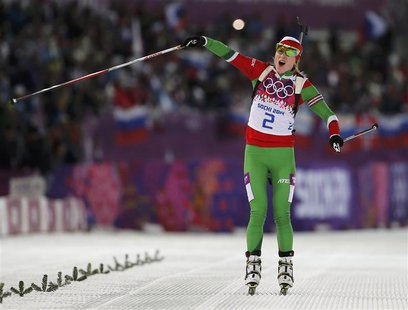 Darya Domracheva of Belarus celebrates as she approaches the finish line to win the women's biathlon 12.5km mass start event at the Sochi 20 Darya Domracheva of Belarus celebrates as she approaches the finish line to win the women's biathlon 12.5km mass start event at the Sochi 20