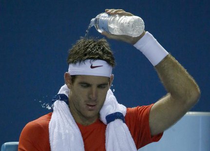 Juan Martin Del Potro of Argentina cools off during his men's singles match against Roberto Bautista Agut of Spain at the Australian Open 20 Juan Martin Del Potro of Argentina cools off during his men's singles match against Roberto Bautista Agut of Spain at the Australian Open 20