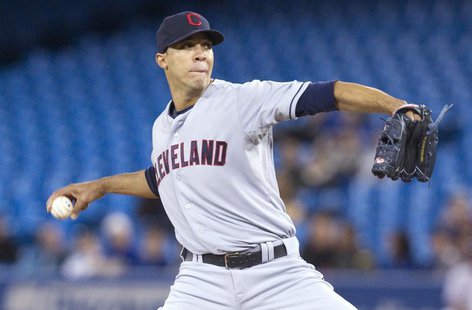 Cleveland Indians pitcher Ubaldo Jimenez throws against the Toronto Blue Jays in the first inning of their MLB baseball game in Toronto Apri Cleveland Indians pitcher Ubaldo Jimenez throws against the Toronto Blue Jays in the first inning of their MLB baseball game in Toronto Apri