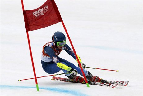 Mikaela Shiffrin of the U.S. clears a gate during the second run of the women's alpine skiing giant slalom event at the 2014 Sochi Winter Ol Mikaela Shiffrin of the U.S. clears a gate during the second run of the women's alpine skiing giant slalom event at the 2014 Sochi Winter Ol