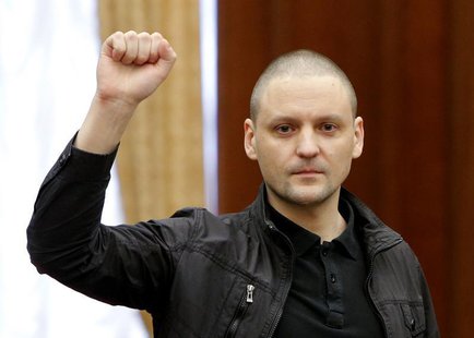 Opposition leader Sergei Udaltsov gestures during a court hearing in Moscow February 18, 2014. REUTERS/Maxim Shemetov Opposition leader Sergei Udaltsov gestures during a court hearing in Moscow February 18, 2014. REUTERS/Maxim Shemetov