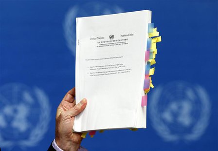 Michael Kirby, Chairperson of the Commission of Inquiry on Human Rights in North Korea, holds a copy of his report during a news conference Michael Kirby, Chairperson of the Commission of Inquiry on Human Rights in North Korea, holds a copy of his report during a news conference