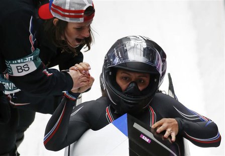 Pilot Elana Myers (front) and Lauryn Williams of the U.S. are congratulated after completing a run in the women's bobsleigh event at the 201 Pilot Elana Myers (front) and Lauryn Williams of the U.S. are congratulated after completing a run in the women's bobsleigh event at the 201