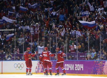 Russia's Ilya Kovalchuk (R) celebrates his goal against Norway with teammates Alexei Yemelin (C) and Alexander Radulov (L) during the second Russia's Ilya Kovalchuk (R) celebrates his goal against Norway with teammates Alexei Yemelin (C) and Alexander Radulov (L) during the second