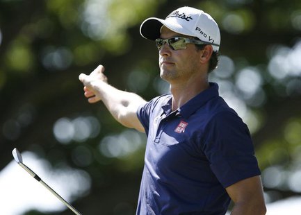 Adam Scott of Australia points as he follows his ball after teeing off on the second hole during the final round of the Sony Open golf tourn Adam Scott of Australia points as he follows his ball after teeing off on the second hole during the final round of the Sony Open golf tourn