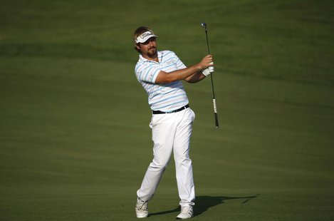 Victor Dubuisson of France hits the ball on the 14th hole during the third round of the DP World Tour Championship in Dubai November 16, 201 Victor Dubuisson of France hits the ball on the 14th hole during the third round of the DP World Tour Championship in Dubai November 16, 201