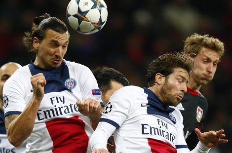Paris St Germain's (L-R) Zlatan Ibrahimovic and Maxwell and Bayer Leverkusen's Stefan Kiessling jump for the ball during their Champions Lea Paris St Germain's (L-R) Zlatan Ibrahimovic and Maxwell and Bayer Leverkusen's Stefan Kiessling jump for the ball during their Champions Lea
