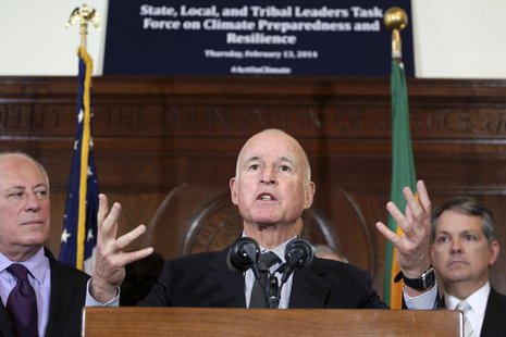 California Gov. Jerry Brown (C) speaks during a media briefing by members of President Barack Obama's Climate Task Force committee in Los An California Gov. Jerry Brown (C) speaks during a media briefing by members of President Barack Obama's Climate Task Force committee in Los An