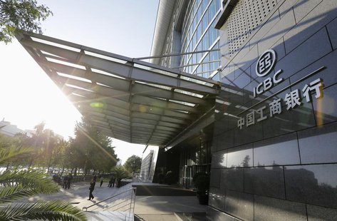 People stand in front of the headquarters building of Industrial and Commercial Bank of China Ltd (ICBC) in Beijing, October 15, 2013. REUTE People stand in front of the headquarters building of Industrial and Commercial Bank of China Ltd (ICBC) in Beijing, October 15, 2013. REUTE