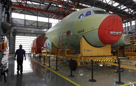 An employee walks past an A320 plane under construction at the final assembly line of Airbus factory in Tianjin municipality, June 13, 2012. An employee walks past an A320 plane under construction at the final assembly line of Airbus factory in Tianjin municipality, June 13, 2012.