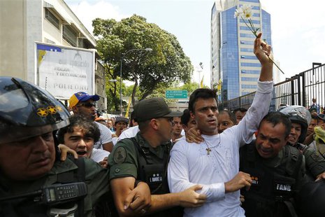 Venezuelan opposition leader Leopoldo Lopez is escorted by national guards before handing himself over in Caracas February 18, 2014. REUTERS Venezuelan opposition leader Leopoldo Lopez is escorted by national guards before handing himself over in Caracas February 18, 2014. REUTERS