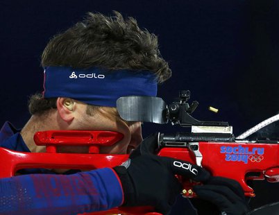 Norway's Ole Einar Bjoerndalen shoots during the mixed biathlon relay at the 2014 Sochi Winter Olympics February 19, 2014. REUTERS/Michael D Norway's Ole Einar Bjoerndalen shoots during the mixed biathlon relay at the 2014 Sochi Winter Olympics February 19, 2014. REUTERS/Michael D
