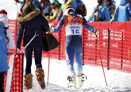 Bode Miller of the U.S. (R) leave the venue with his wife Morgan Beck after the men's alpine skiing giant slalom event at the 2014 Sochi Win Bode Miller of the U.S. (R) leave the venue with his wife Morgan Beck after the men's alpine skiing giant slalom event at the 2014 Sochi Win