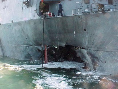 The port side damage to the guided missile destroyer USS Cole is pictured after a bomb attack during a refueling operation in the port of Ad The port side damage to the guided missile destroyer USS Cole is pictured after a bomb attack during a refueling operation in the port of Ad