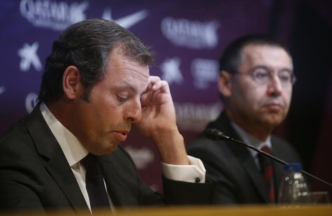 Barcelona president Sandro Rosell (L) attends a news conference where he announced his resignation, next to vice-president Josep Maria Barto Barcelona president Sandro Rosell (L) attends a news conference where he announced his resignation, next to vice-president Josep Maria Barto