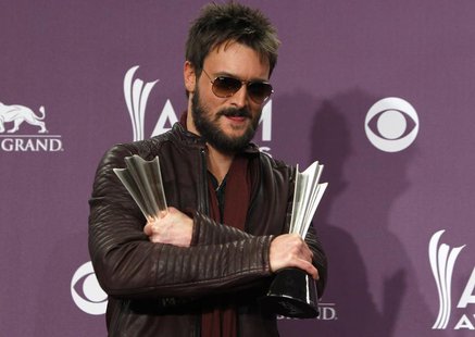 Eric Church holds his awards for album of the year and vocal event of the year at the 48th ACM Awards in Las Vegas April 7, 2013. REUTERS/St Eric Church holds his awards for album of the year and vocal event of the year at the 48th ACM Awards in Las Vegas April 7, 2013. REUTERS/St