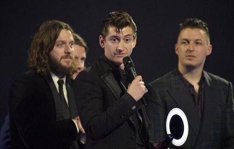 Alex Turner (C) of the Arctic Monkeys talks after being presented with the British Album award at the BRIT Awards, celebrating British pop m Alex Turner (C) of the Arctic Monkeys talks after being presented with the British Album award at the BRIT Awards, celebrating British pop m