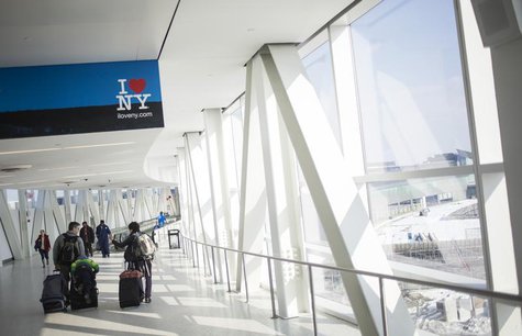 Travelers are seen at John F. Kennedy International airport in the Queens borough of New York February 14, 2014. REUTERS/Eric Thayer Travelers are seen at John F. Kennedy International airport in the Queens borough of New York February 14, 2014. REUTERS/Eric Thayer