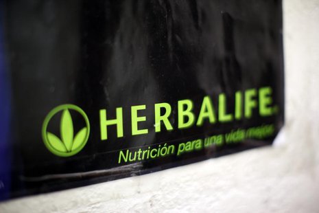 A Herbalife logo is shown on a poster at a clinic in the Mission District in San Francisco, California April 29, 2013. REUTERS/Robert Galbra A Herbalife logo is shown on a poster at a clinic in the Mission District in San Francisco, California April 29, 2013. REUTERS/Robert Galbra