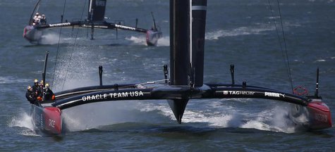 Oracle Team USA sails toward the finish line ahead of Emirates Team New Zealand to win Race 17 of the 34th America's Cup yacht sailing race Oracle Team USA sails toward the finish line ahead of Emirates Team New Zealand to win Race 17 of the 34th America's Cup yacht sailing race