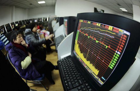 Investors look at computer screens displaying stock information at a brokerage house in Qingdao, Shandong province February 10, 2014. REUTER Investors look at computer screens displaying stock information at a brokerage house in Qingdao, Shandong province February 10, 2014. REUTER