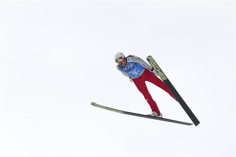 Germany's Eric Frenzel soars through the air during the trial round of the large hill ski jumping portion of the Nordic Combined team Gunder Germany's Eric Frenzel soars through the air during the trial round of the large hill ski jumping portion of the Nordic Combined team Gunder
