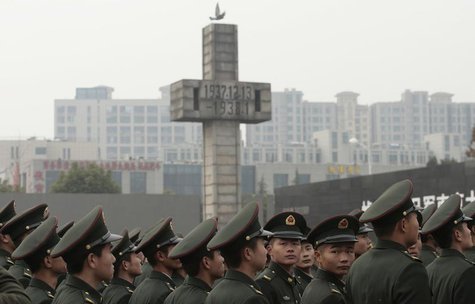 Military personnel attend a ceremony marking the 74th anniversary of the start of the Nanjing Massacre at the Nanjing Massacre Museum, Jiang Military personnel attend a ceremony marking the 74th anniversary of the start of the Nanjing Massacre at the Nanjing Massacre Museum, Jiang