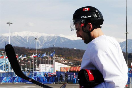 Canada's ice hockey player Patrice Bergeron walks to the Bolshoy arena following a men's team practice at the 2014 Sochi Winter Olympics Feb Canada's ice hockey player Patrice Bergeron walks to the Bolshoy arena following a men's team practice at the 2014 Sochi Winter Olympics Feb