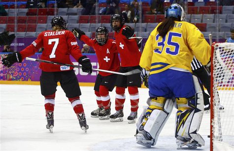 Switzerland's Jessica Lutz (R) celebrates her goal against Sweden's goalie Valentina Wallner (L) with teammates Sara Benz (13) and Lara Stal Switzerland's Jessica Lutz (R) celebrates her goal against Sweden's goalie Valentina Wallner (L) with teammates Sara Benz (13) and Lara Stal