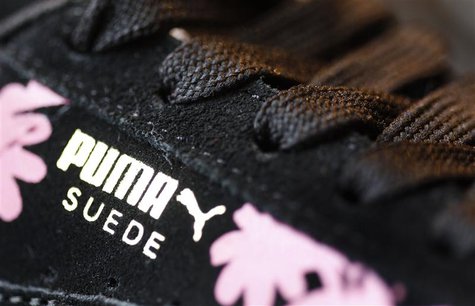 The logo of German sports goods firm Puma is seen on a shoe after the company's annual news conference in Herzogenaurach February 20, 2014. The logo of German sports goods firm Puma is seen on a shoe after the company's annual news conference in Herzogenaurach February 20, 2014.